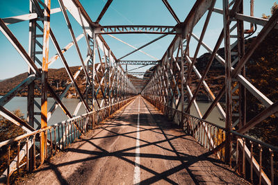 Footbridge against clear sky