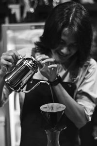 Barista preparing coffee at cafe