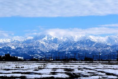Snow covered mountains against sky