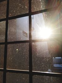 Low angle view of sunlight streaming through window