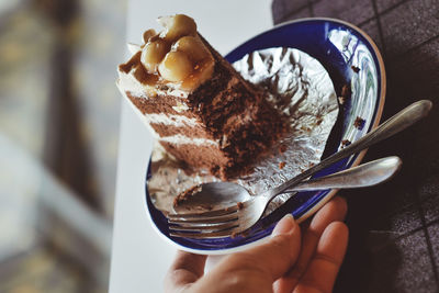 Close-up of hand holding ice cream