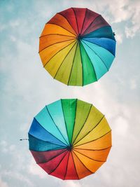 Low angle view of colorful umbrella against sky