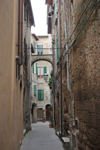 Narrow alley amidst buildings in city