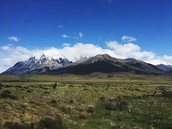 Scenic view of landscape against cloudy sky