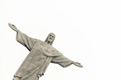 Low angle view of statue against white background