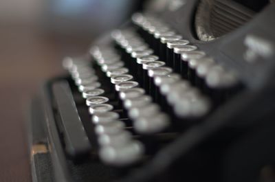 Close-up of old machine part on table