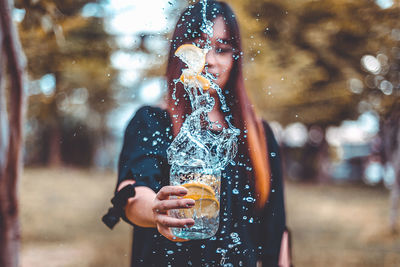 Young woman drinking glass