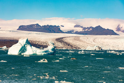 Scenic view of snowcapped mountains against sky