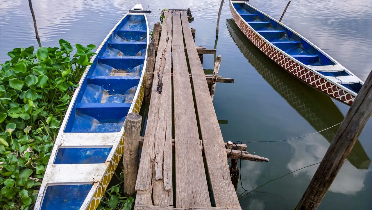 water, nautical vessel, boat, transportation, moored, mode of transport, rope, lake, high angle view, sailboat, reflection, rippled, mast, day, waterfront, river, nature, harbor, outdoors, pier