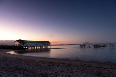 Scenic view of beach against sky during sunset