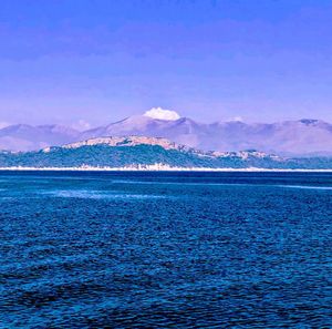 Scenic view of sea against blue sky