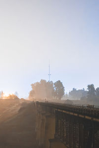View of bridge and buildings against sky