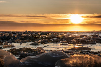 Scenic view of sea against sky during sunset