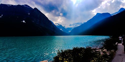 Panoramic view of sea and mountains against sky