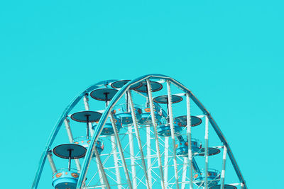 Low angle view of ferris wheel against clear sky