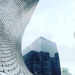 Low angle view of museo soumaya by building against sky