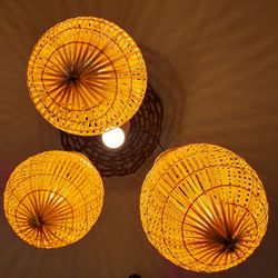 Low angle view of illuminated lanterns hanging on ceiling