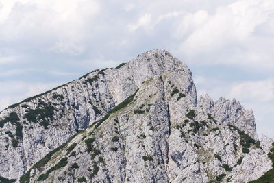 Low angle view of rock formation against sky