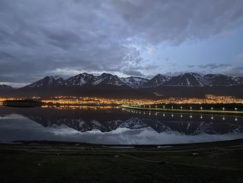 Scenic view of lake against sky at night