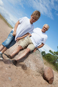 Grandfather with grandson at beach