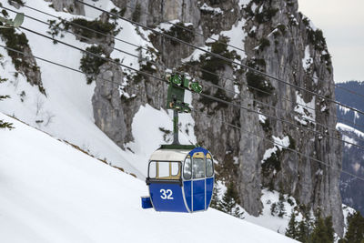 Blue gondola at kampenwand in bavaria, germany, wintertime