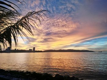Scenic view of sea against sky at sunset