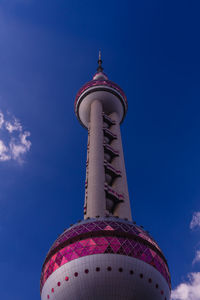 Low angle view of building against blue sky