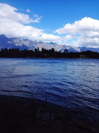 Scenic view of lake against sky during winter