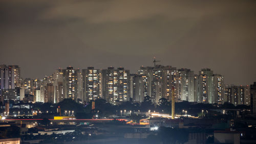 Illuminated buildings in city at night