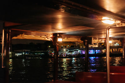 Illuminated lights in water at night