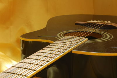 Close-up of guitar on fabric