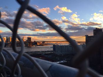 Close-up of cityscape against sky during sunset