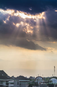 View of city against sky at sunset