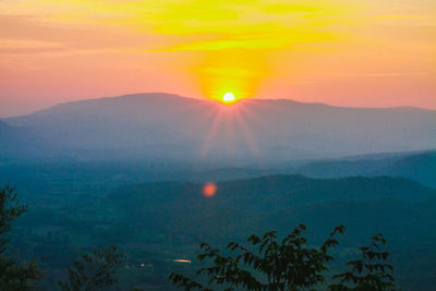 Scenic view of mountains against sky during sunset