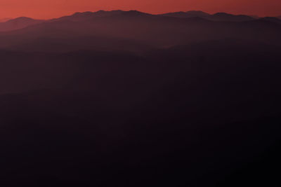 Scenic view of silhouette mountain against sky during sunset