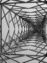 Low angle view of modern telecommunication tower against the sky