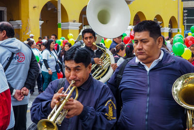 Group of people playing at music concert