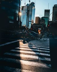 Illuminated city street at dusk