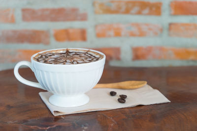 Close-up of coffee cup on table