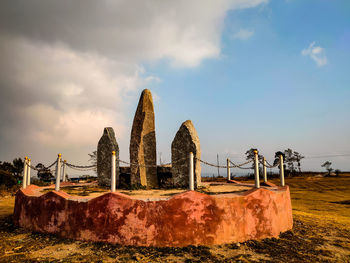 Panoramic view of old ruin on field against sky