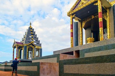 Rear view full length of man standing outside temple