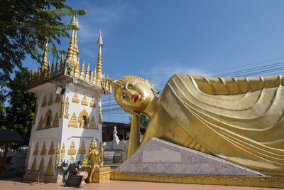 Low angle view of statue against building