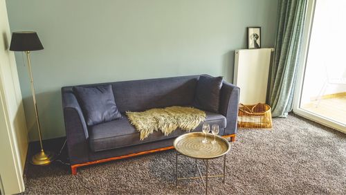 Chairs and table on sofa at home