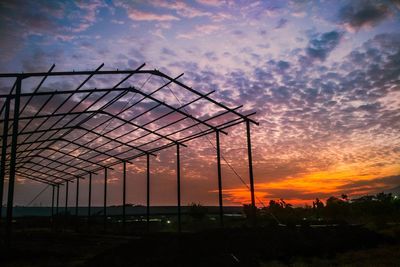 Silhouette landscape against sky during sunset