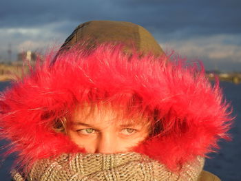 Portrait of girl wearing fur coat at dusk during winter 