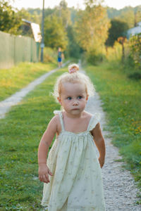 Cute girl standing on field