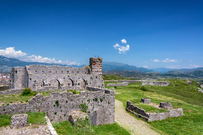 Old ruin building against blue sky