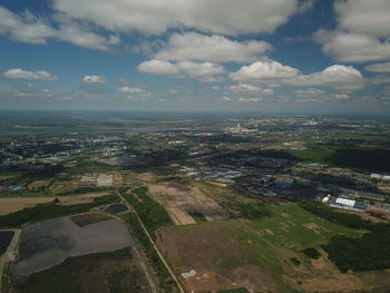 High angle view of city buildings against sky