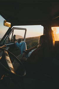 Man sitting in car