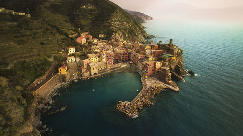 High angle view of buildings by sea